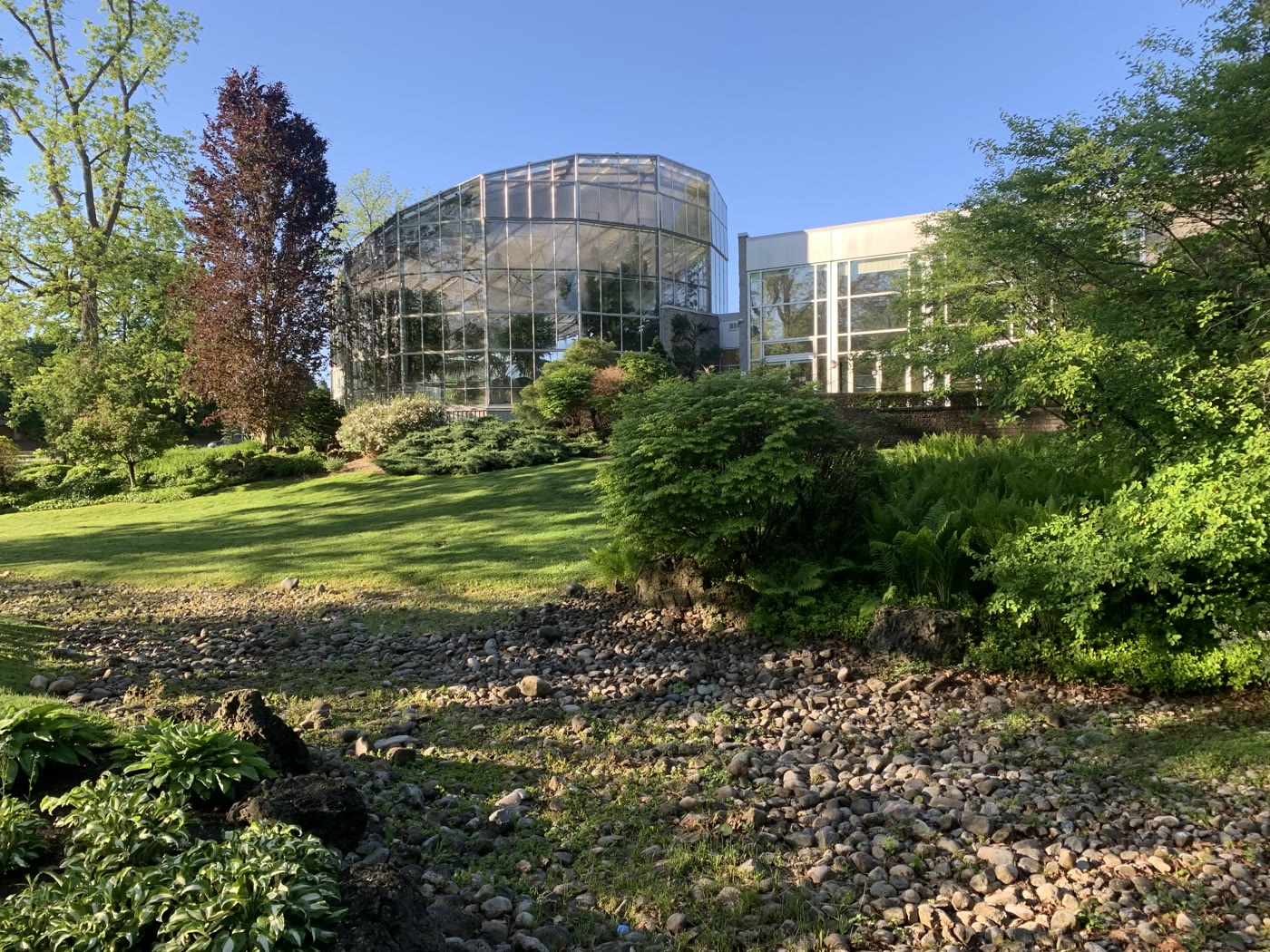 The glass conservatory and rock garden in a London park
